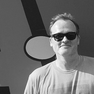Black and white picture of Rob in sunglasses